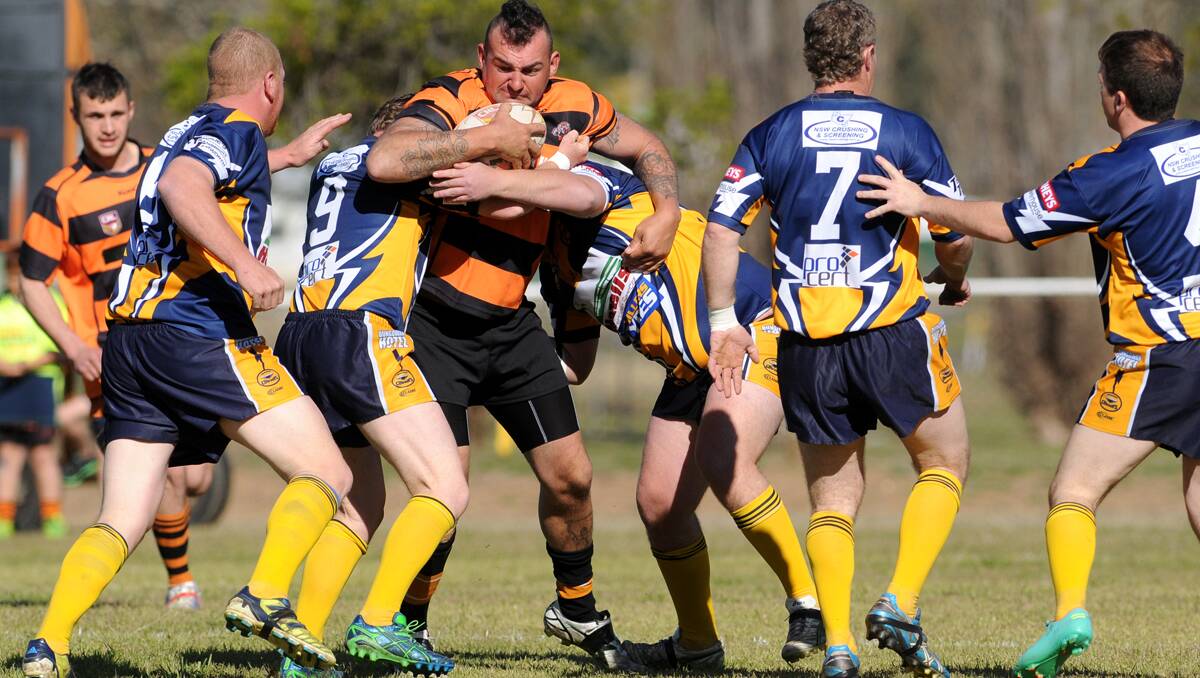 Dungowan defenders swarm for Manilla prop Dan Fawkes during Saturday’s Group 4 Second Division clash. Photo: Barry Smith  100813BSC01
