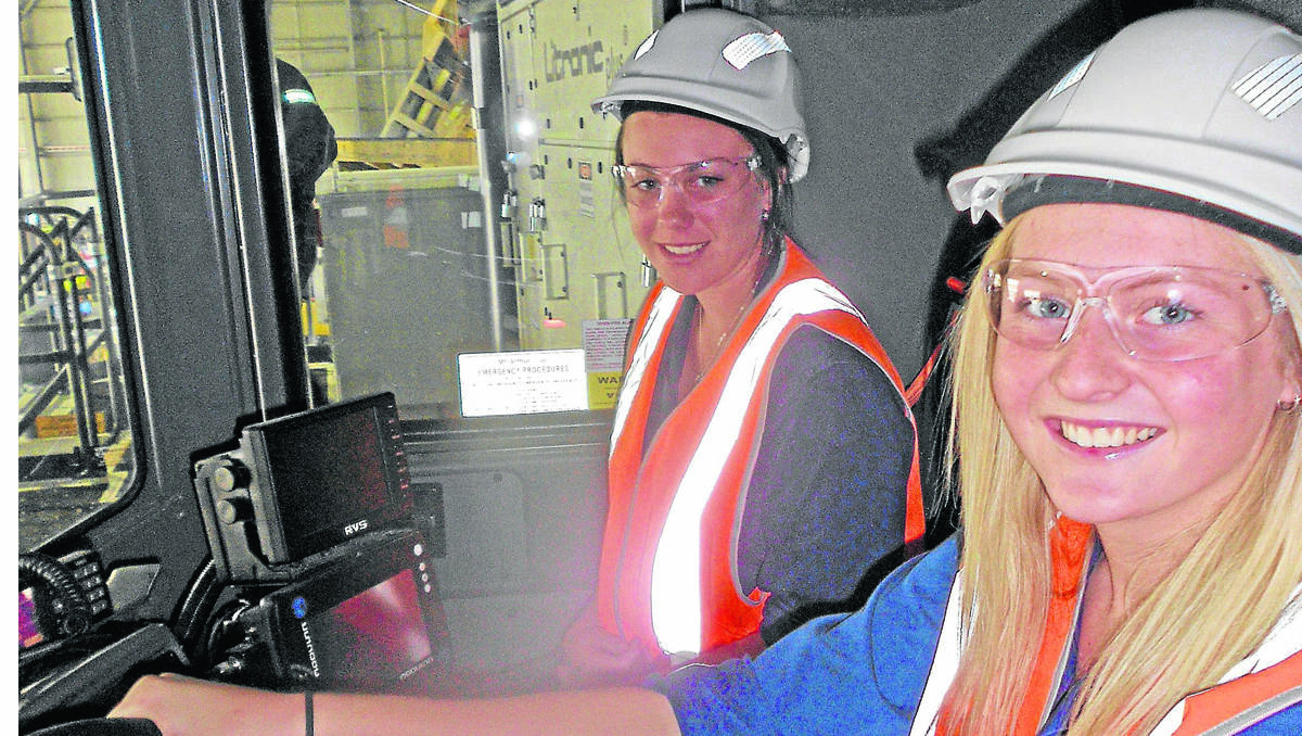 TESTING THE TRADE: Gunnedah High School students Brooke Wicks and Montana Dries find out what it’s like to work at one of BHP Billiton’s open-cut mines.