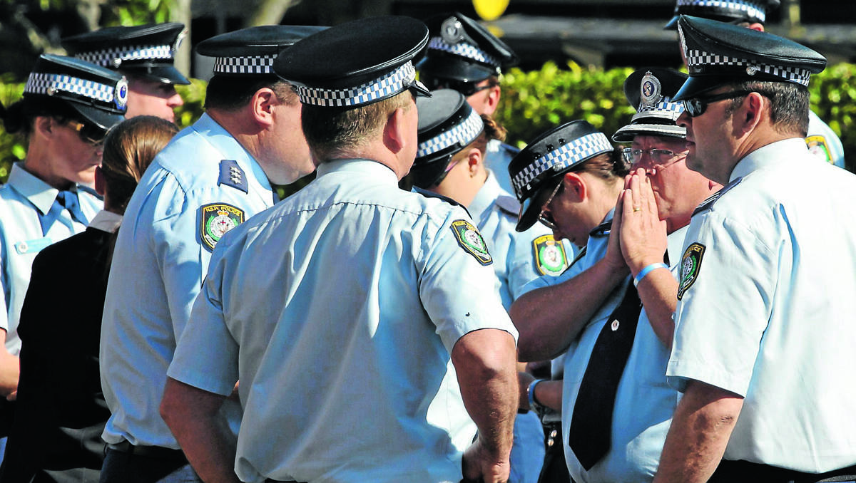 DAY OF RECKONING: Police from the Oxley Local Command come to terms with the sentence, just moments after Michael Allan Jacobs was given life in prison yesterday.