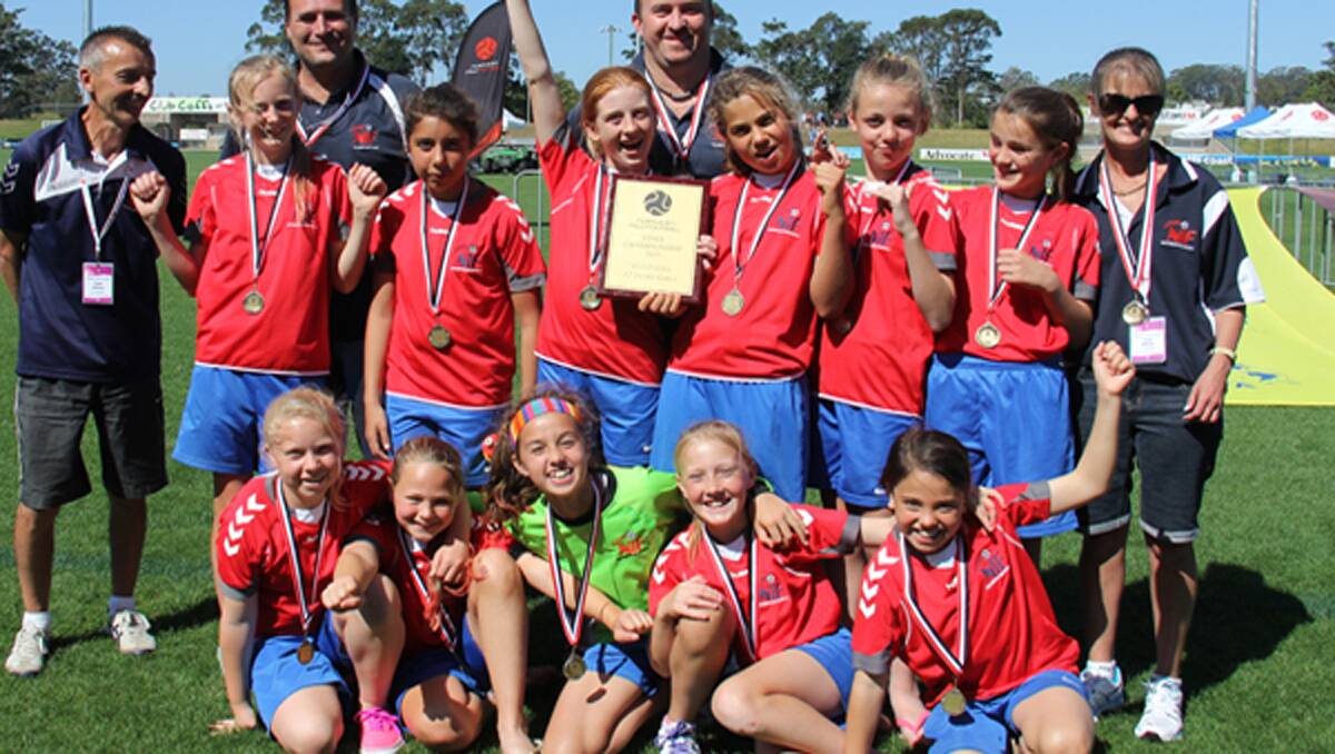 Northern Inland Football’s Under 12s celebrate a State Championship.