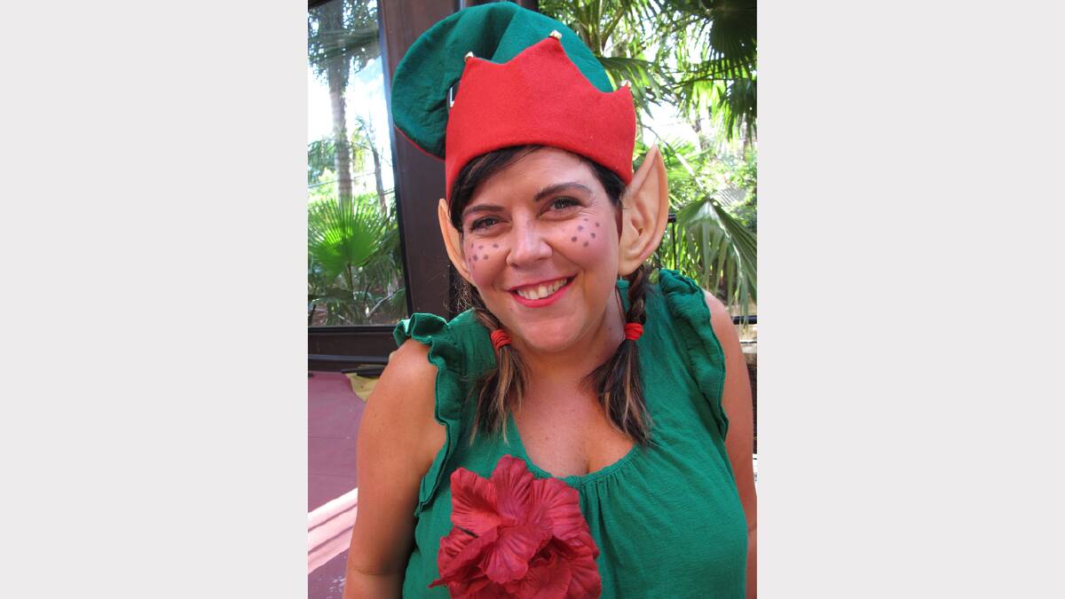 The cutest elf in town - Christie Galloway shows off her pointy ears during this year's Santa Crawl. Photo: Kitty Hill