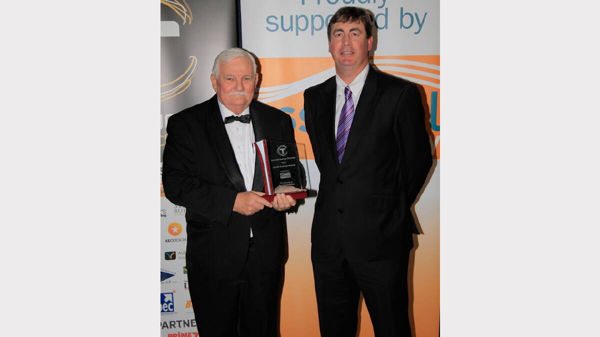 Bill Page from The Best Western Sanctuary Inn, winner of the Excellence in Accommodation award, and David George of Qantaslink at the Quality Business Awards held at TRECC on Friday night. Photo: Robert Chappel