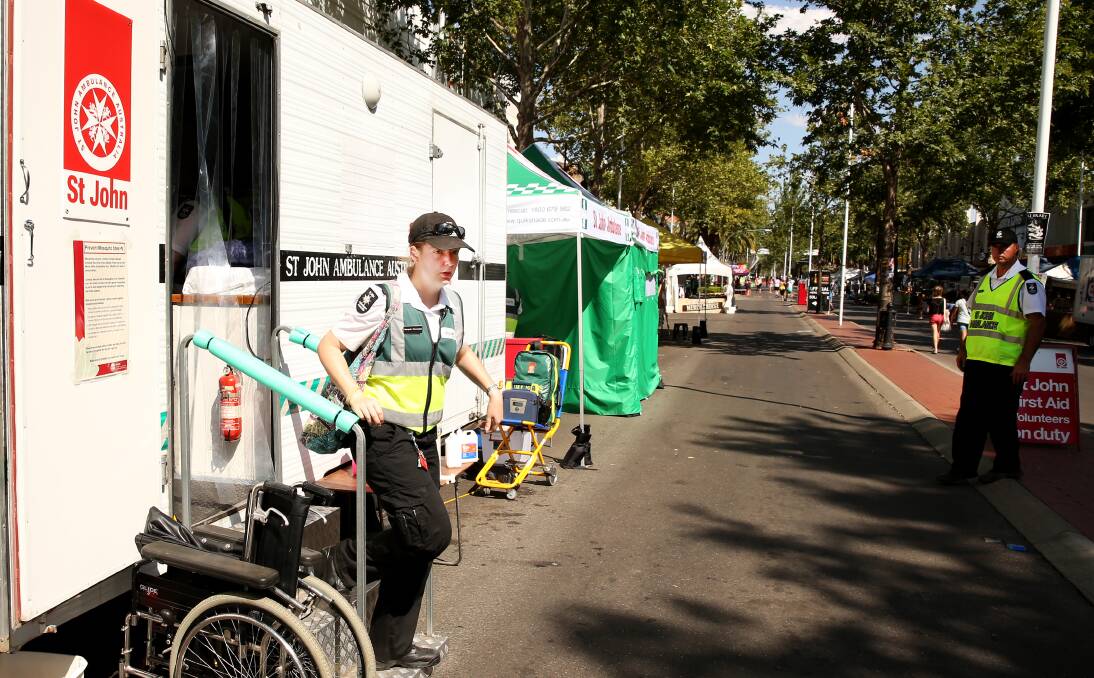 ON THE JOB: Jaquie Hennessy from St John Ambulance leaves the Peel St post on her way to treat a festivalgoer. Photo:  Matt Bedford 210114MBI02