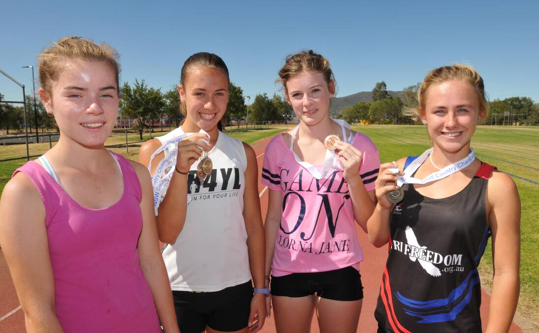 Athletes (from left) Alexandra Reed, Leah Mills, Emily Sheppard and Ella Heeney, along with sister Sophie Heeney (absent) brought home eight medals and three golds from the NSW Country Championships. Photo: Geoff O’Neill 290114GOD01