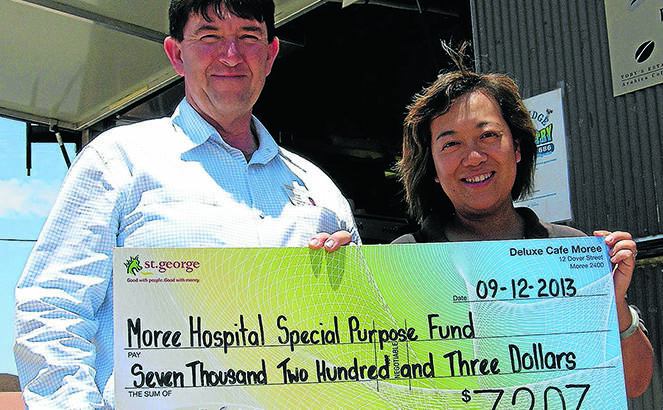 amazing generosity: Moree hospital CEO David Quirk and Deluxe Cafe proprietor Cindy Poulos with a cheque for donations made by customers during the past two-and-a-half years.