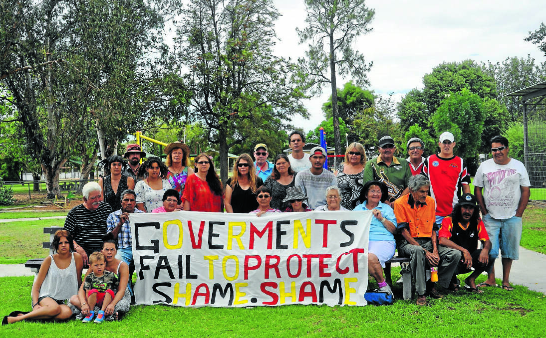 STANDING FIRM: Members of the Gomeroi community make their feelings known at a protest outside Whitehaven Coal’s Boggabri office yesterday.