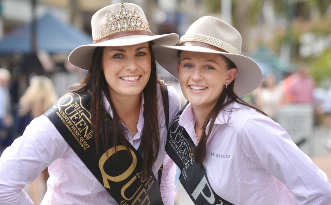 TAMWORTH ROYALTY: The new festival queen, Lucinda Whitehorn, left, with princess Susie Coombs in Peel St yesterday. Photo: Barry Smith 240114BSD01