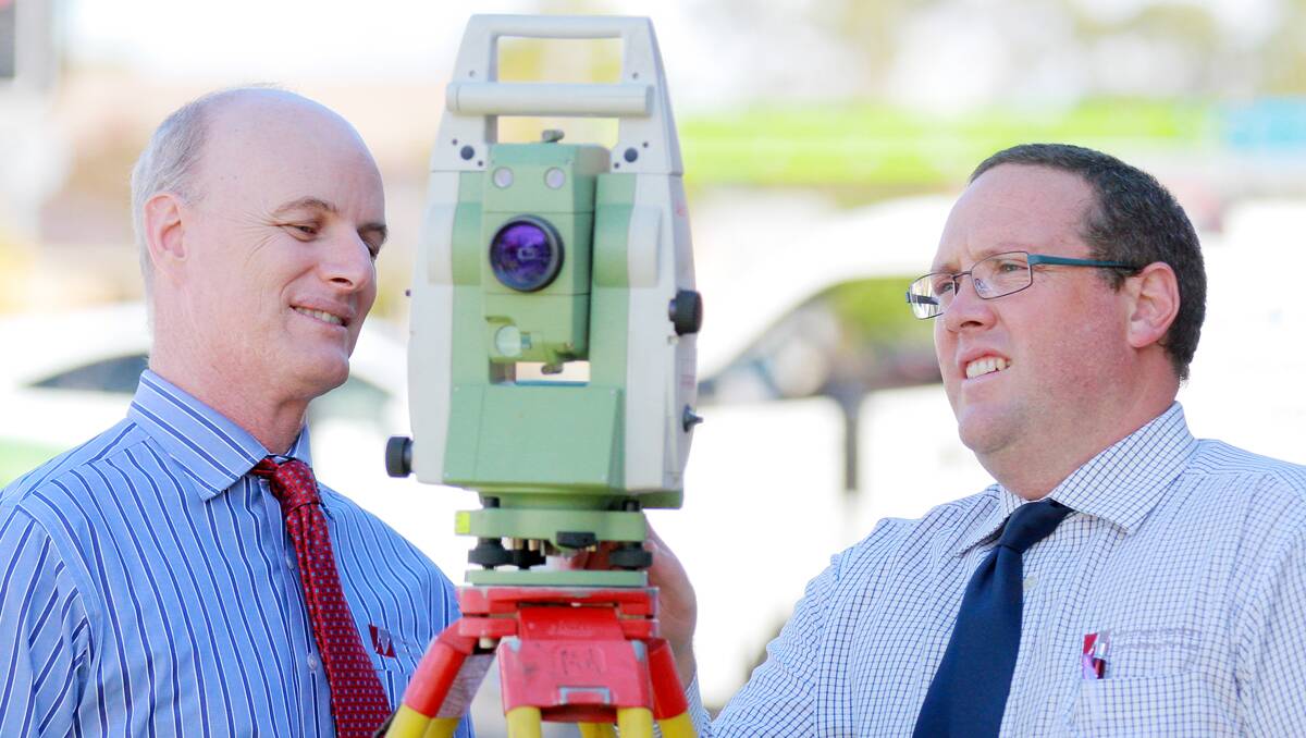 A RARE BREED: Tamworth surveyors Mitch Hanlon and Tim Milsom are just some of a handful of regional surveyors who are experiencing a  shortfall in workers. Photo: Robert Chappel 110313RCC01