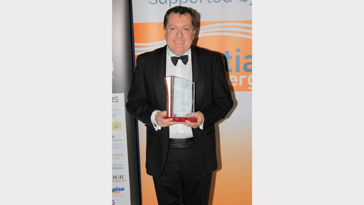 The Capitol Theatre's Peter Ross receives the award for Excellence in Media and Entertainment at the Quality Business Awards held at TRECC on Friday night. Photo: Robert Chappel