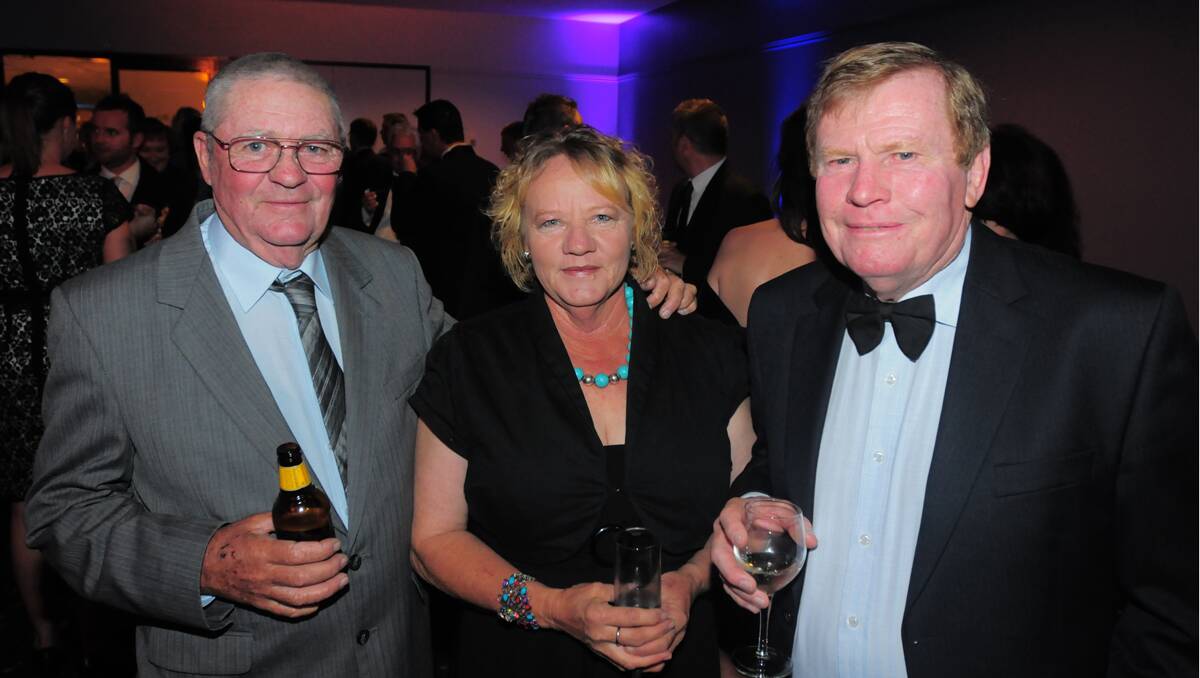 John and Liz O'Brien with Charles Nott from Clover Car Wash at the Quality Business Awards held at TRECC on Friday night. Photo: Robert Chappel