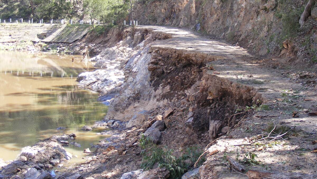 HOW IT WAS: The state of Limbri-Weabonga Rd just after the flood of November 2008. Photo: Ann Newling