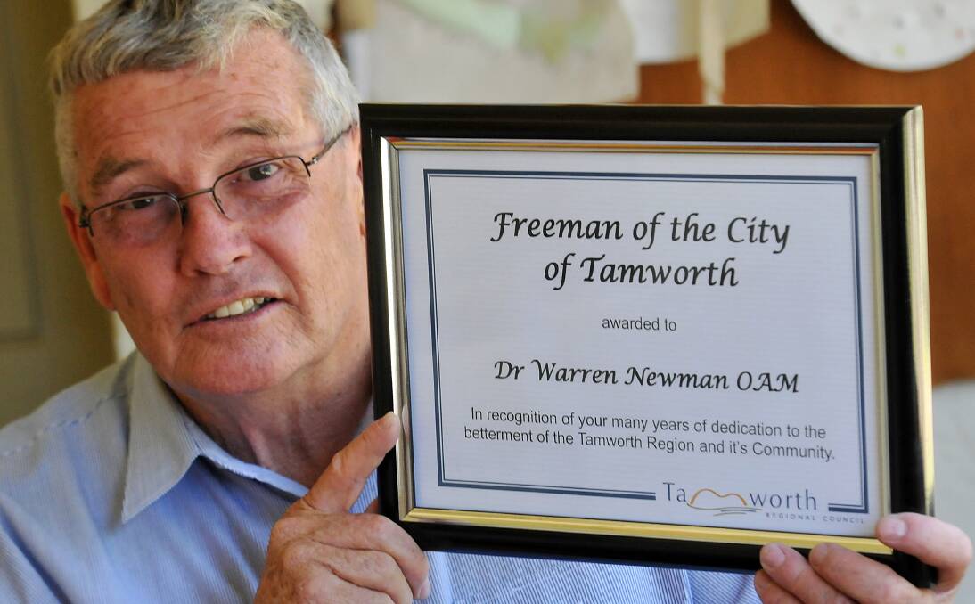 ANOTHER HONOUR: Family friend Euan Cootes with the Freeman of the City citation awarded to Warren Newman yesterday. Photo: Geoff O’Neill 031213GOD01 