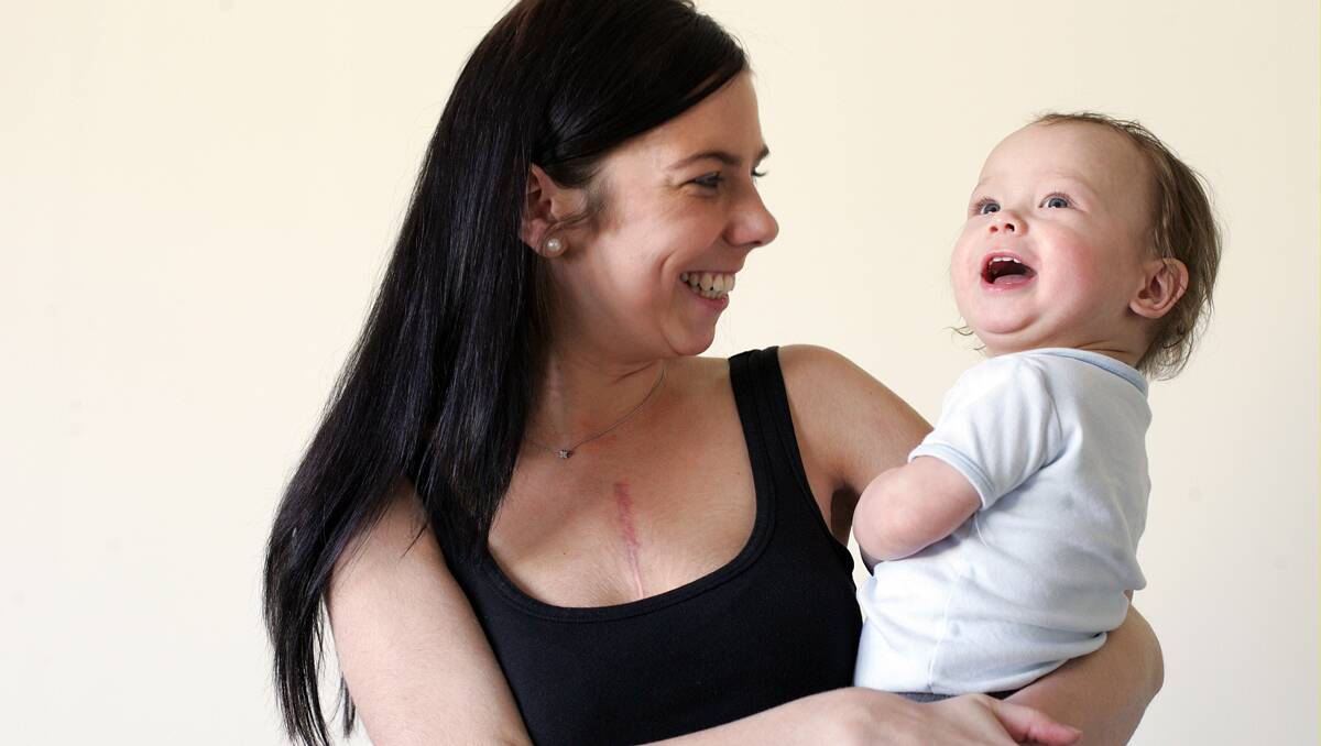 ‘I just wanted to cuddle him’: Leonnee Pinchen-Martin is back home and now able to pick up her son, Levi, 1, after a heart transplant operation. Photo: Kitty Hill 060812KHA01