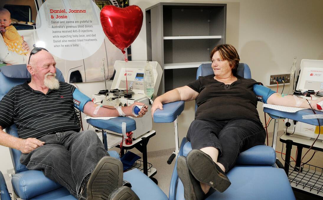 HEARTFELT THANKS: Ron and Anne Johnson know how easy it is to give blood and have each notched up more than 100 donations. Photo: Gareth Gardner 191213GGI01