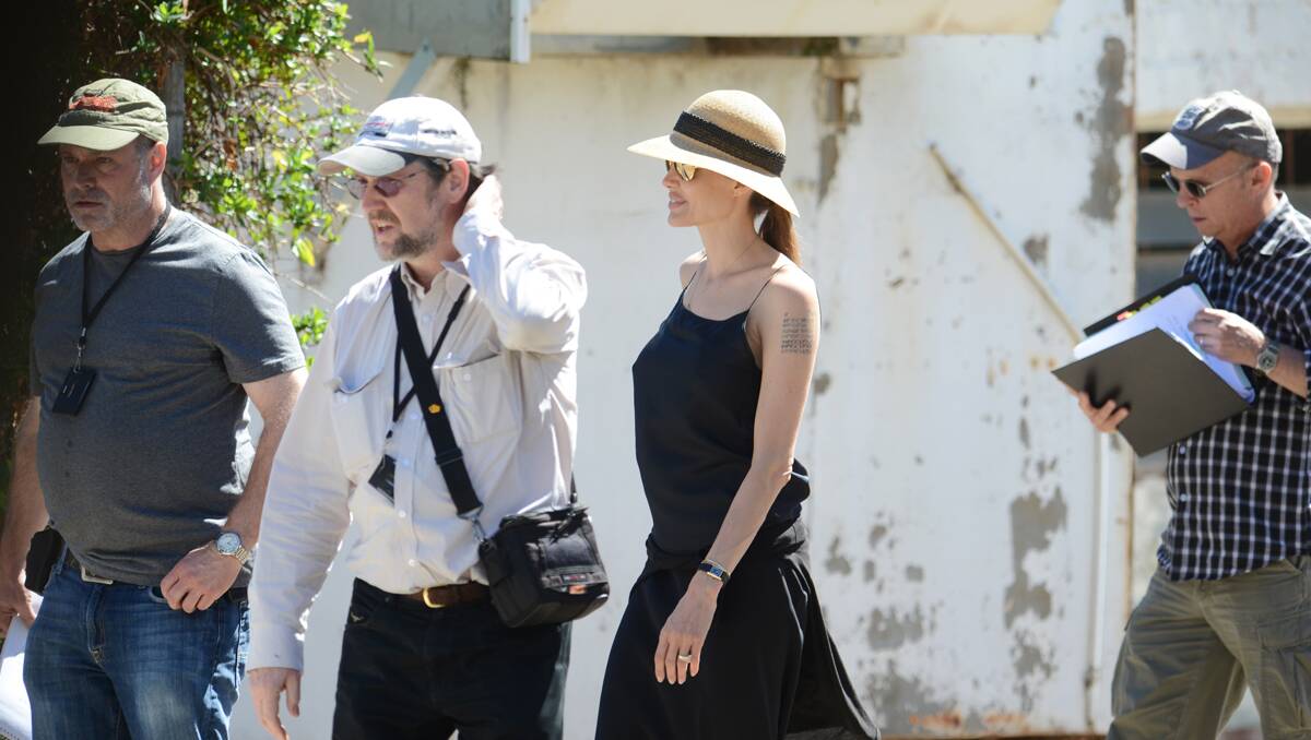 LOOKING AROUND: Angelina Jolie with crew members attached to upcoming movie Unbroken scout around possible filming locations in Werris Creek yesterday. Photo: Barry Smith 110913BSA16