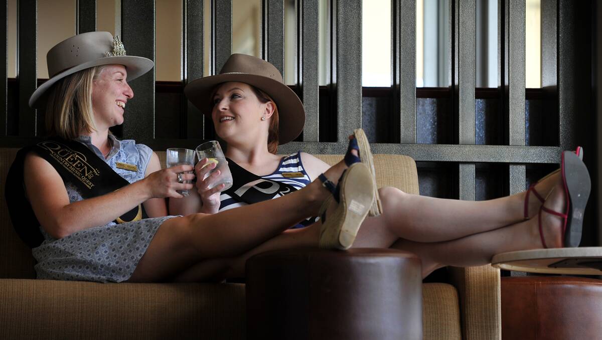 ROAD TO RETIREMENT: 2012 Tamworth Queen of Country Music Dimity Chaseling, left, and Princess Shae McIntosh taking a break. Photo: Barry Smith 250113BSE07