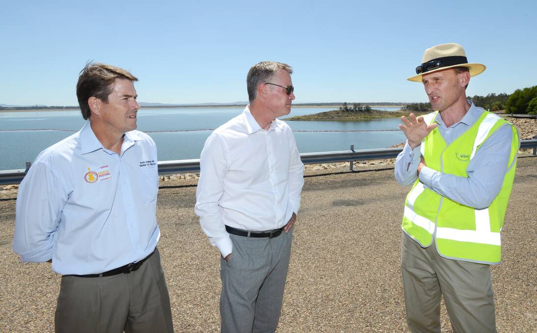CYNICAL: Member for Tamworth Kevin Anderson, left, and deputy premier Andrew Stoner, talk with State Water chief executive Brett Tucker during Mr Stoner’s visit to Lake Keepit late last week. Photo: Barry Smith 170114BSC03