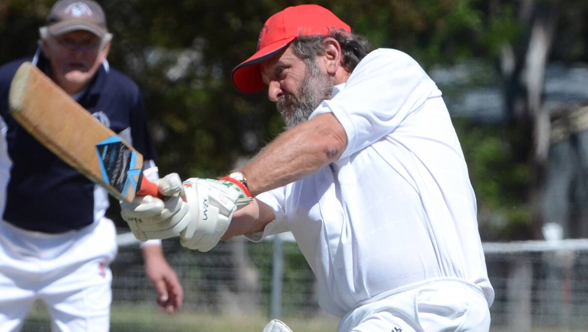 Garry Clarke launches into a shot  yesterday for UNEX at the Northern NSW Over 60s Cricket Carnival in Armidale.  Photo: www.pixonline.com