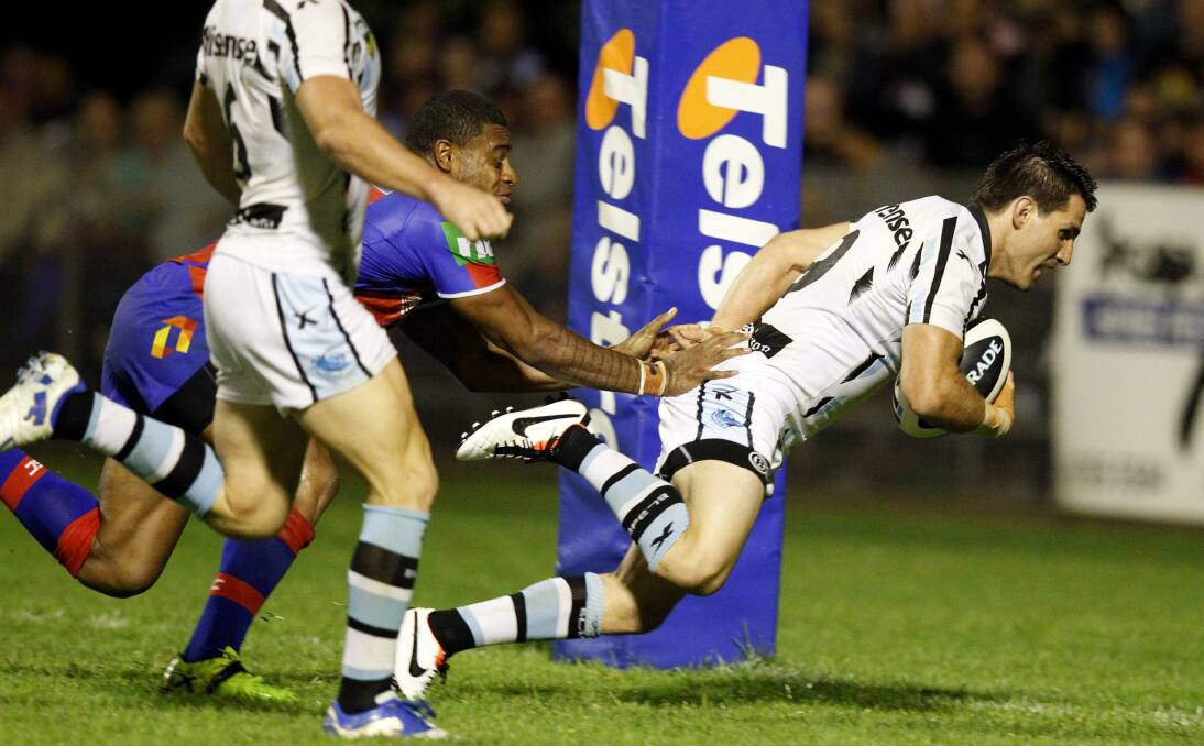 MANY MEMORIES: A league trial match was held at Scully Park, with the Newcastle Knights vs the Cronulla Sharks, in February. Pictured is Sharks player Isaac De Gois scoring a try. Photo: Jonathan Carroll