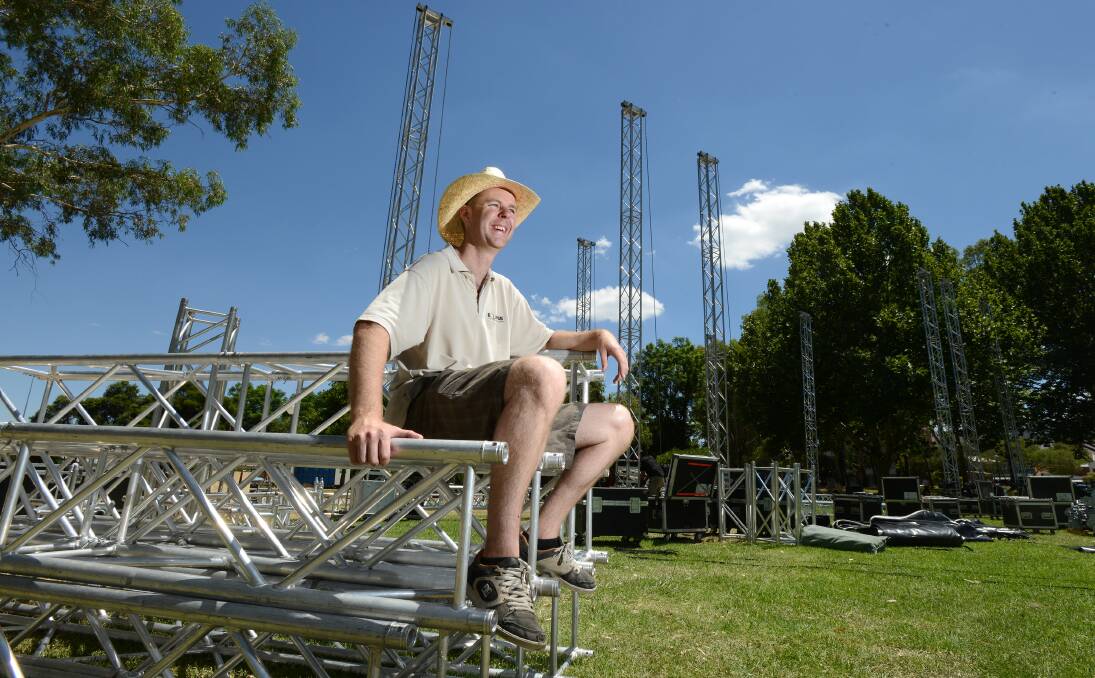 STAGE MANAGER: Queanbeyan production manager for the Eclipse company, Chris Neal, surveys the infrastructure trucked in ahead of the transformation of Bicentennial Park into a premier festival space.  Photo: Barry Smith 130114BSA02  