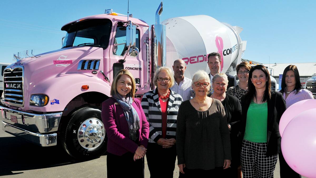 PRETTY IN PINK: A head-turning pink concrete truck was handed over to Redimix Concrete yesterday, watched by Serendipity committee members, front from left, Min McDonald, Ruth Campbell, Sandy Brooks, Caroline Wright, Helen Hill and Trina Constable, with, far right, Katrina Zader from JT Fosseys Trucks, and back row, James McDonald of Redimix and JT Fosseys Trucks sales manager John Saint. Photo: Geoff O’Neill 260813GOB01