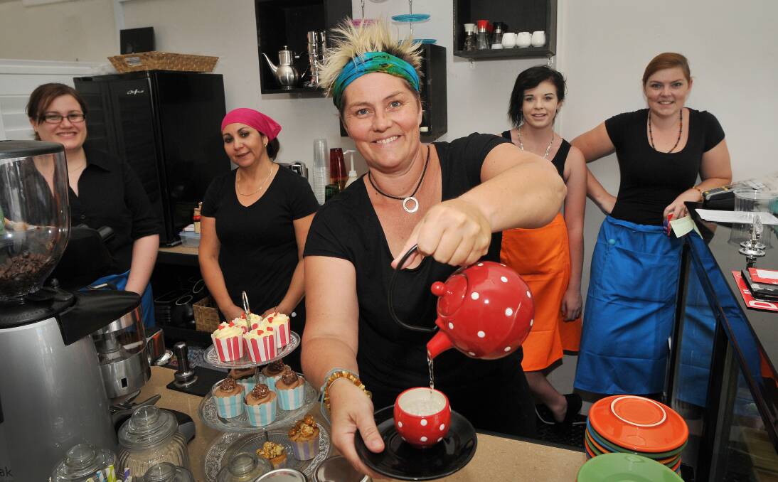 TEA, ANYONE? Kim Fisher, back left, Jessica Soto, Tahla Davis and Ricky Frankel watch on as Karryn Davis pours a tea at the newly opened Teamo Teahouse in Peel St, Tamworth. Organic, homemade food is also available, with lunch and dinner served. Photo: Gareth Gardner 080114GGE01