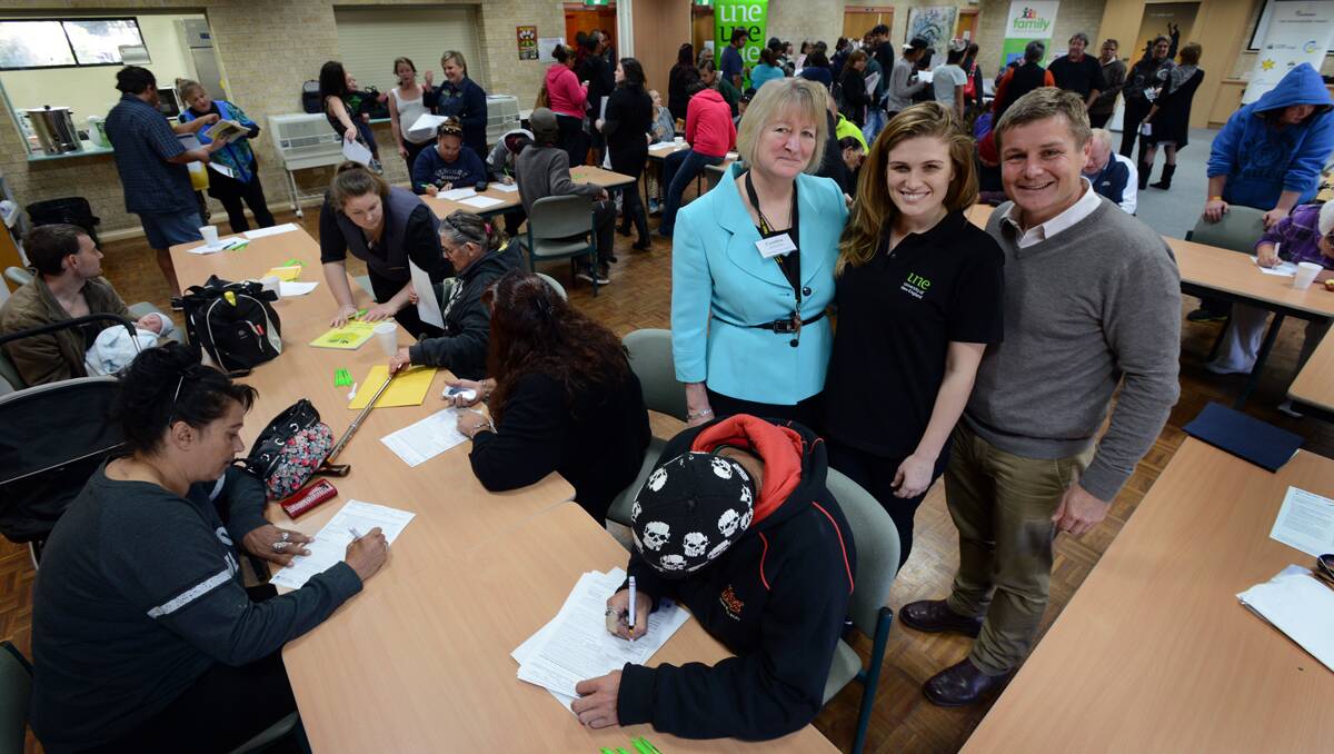 SEEKING PROOF: Hundreds registered for free birth certificates at Coledale Community Centre yesterday. On hand were Cynthia Stulmiller (UNE), Maja Popovic (Enactus UNE) and Will Winter (Minimbah Project co-ordinator).  Photo: Barry Smith  180613BSB07