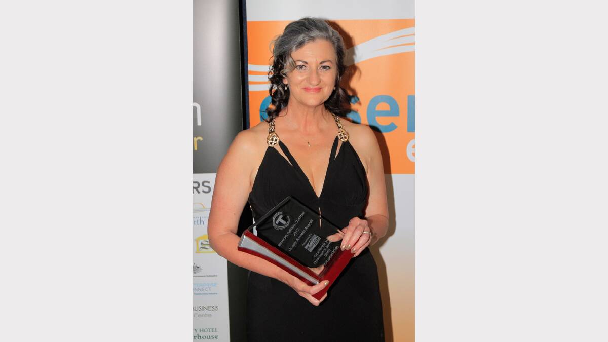 Deb Maes from ImagineMORE receives her award for Excellence in Professional Services (small) at the Quality Business Awards held at TRECC on Friday night. Photo: Robert Chappel