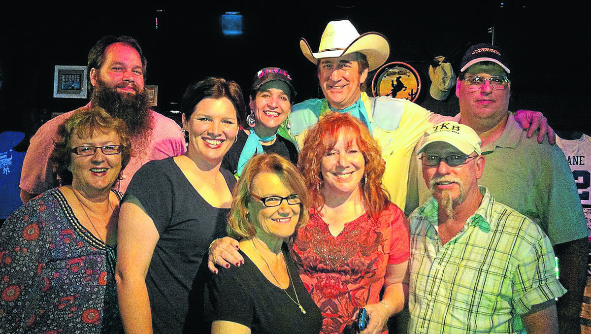 GOOD NIGHT: The gang at Rooster’s back from left, drummer Joe Giotta, LeeAnne and Joel Ulmer and steel player Shawn Sprouse. Front, me, Angela Daly, Patti Mitchell, Marie Hodson and Perry Bolin. Photo: Jeff Webber