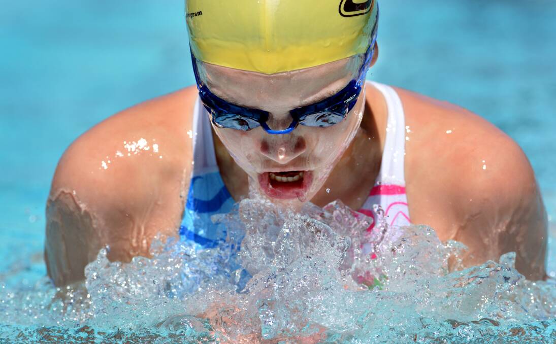 Armidale Alligators’ Lucy Fenwicke powers through the water in the 12yrs girls’ 100m breaststroke at the New England and North West  Championships on Sunday.  Fenwicke was one of the stars of the carnival, breaking two records and winning the age championship.  Photo: Barry Smith 011213BSC29