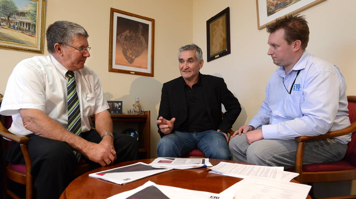 BRIEFING: From left, Tamworth mayor Col Murray met with Electrical Trade Union representatives Steve  Butler and Paul Lister to discuss the impacts the  privatisation of the electricity network would have on the area. Photo: Barry Smith 130813BSB02