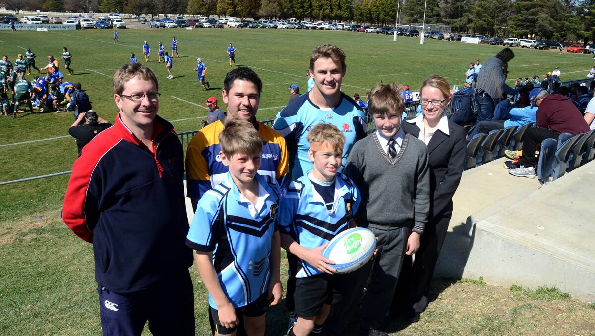 At yesterday’s launch for the January rugby camp (back from left) New England Rugby Camp convener Paul Schmude, ARU North West Development Manager Steve O’Brien, NSW Waratah Pat McCutcheon and carnival sponsor New England Mutual representative Rebecca Watson with North West players (front from left) Charlie Radford (Rowena PS), Deuchar Dight (Yetman PS) and former NW representative Jack Radford (TAS). Photo: www.pixonline.com.au