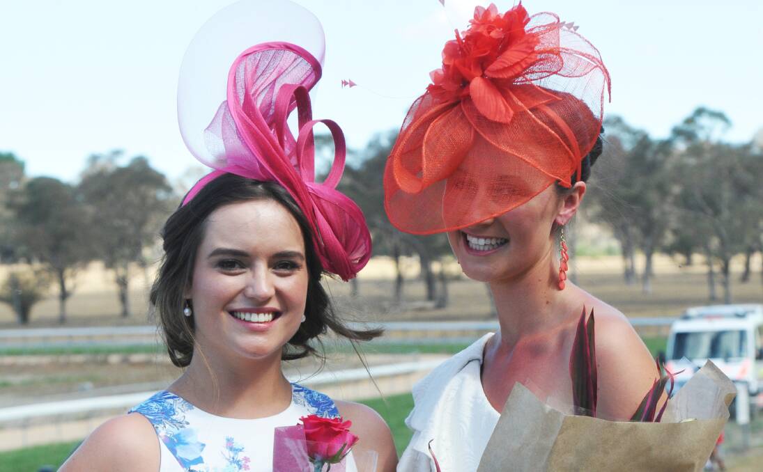 FASHIONABLE FILLIES: Alexander Hall of Bundarra, left, and  Gemma Yarnold from Woolbrook were among the fashion winners at yesterday’s Walcha Cup meeting. Photo: Geoff O’Neill 070214GOA12