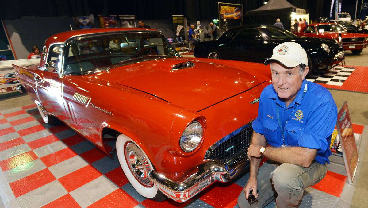HEY GOOD LOOKING: Neville Evans of the Rotary Club of Tamworth West at the Shannons Country Classic Motor Show with his 1957 Ford Thunderbird convertible.  Photo: Geoff O’Neill 280413GOA04