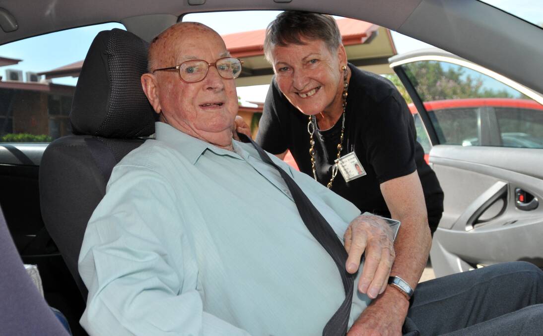 GREAT HELP: Co-Care Inc volunteer Pam Pavey makes sure her client, 93-year-old Keith Hamilton, is buckled up. Mr Hamilton is just one of dozens of elderly Tamworth residents who rely on the service each week. Photo: Geoff O’Neill 311213GOB02