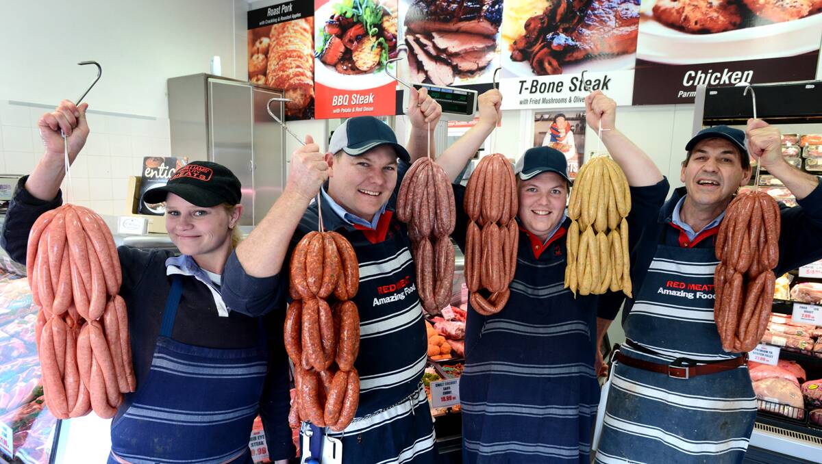 CALALA KINGS: McWilliams Meats Calala staffers, from left, Kirstey Elsley, snag maker and manager Chris Bruton with Dusty Bleasdale and Phil Harris. Photo: Barry Smith 090813BSD03 