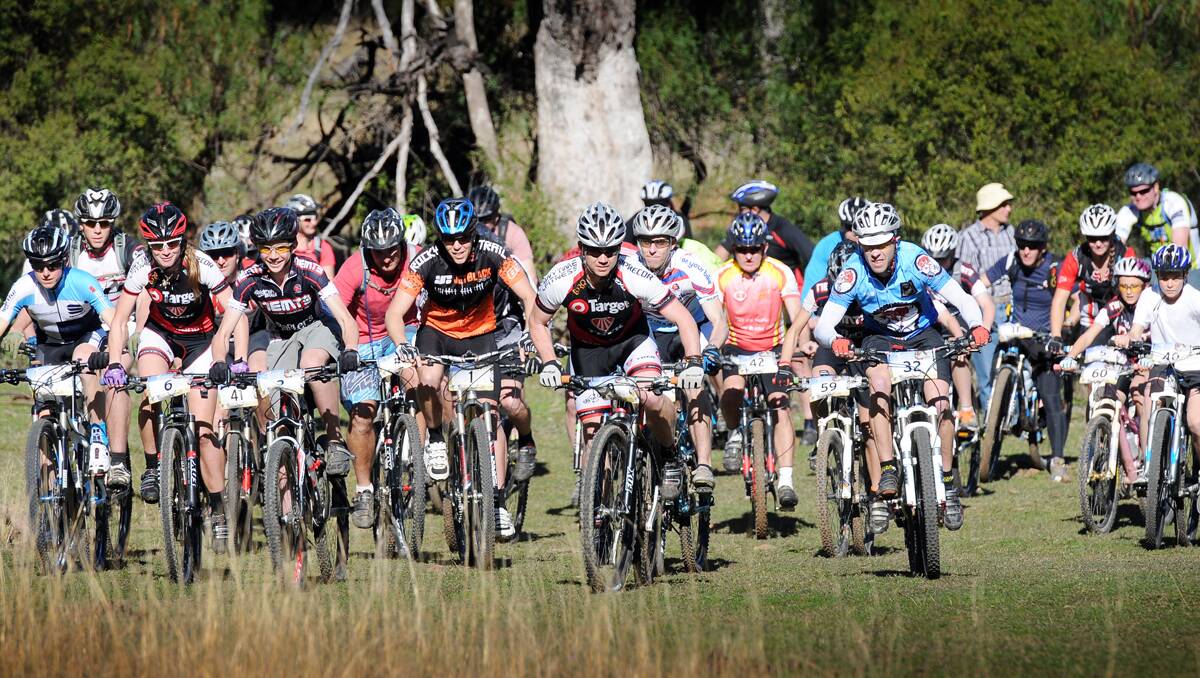 The starters in Sunday’s mountain bike challenge head off. Eventual winner, Queenslander Sean Bekkers, can be seen in the Target jersey in the front  middle.  Photo: Gareth Gardner 070713GGF01