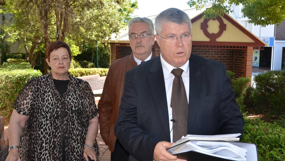 CHARGES DROPPED: Phillip Cameron's solicitor Mark Daly reads a statement outside Armidale Court today. Photo: Stephen Jeffrey