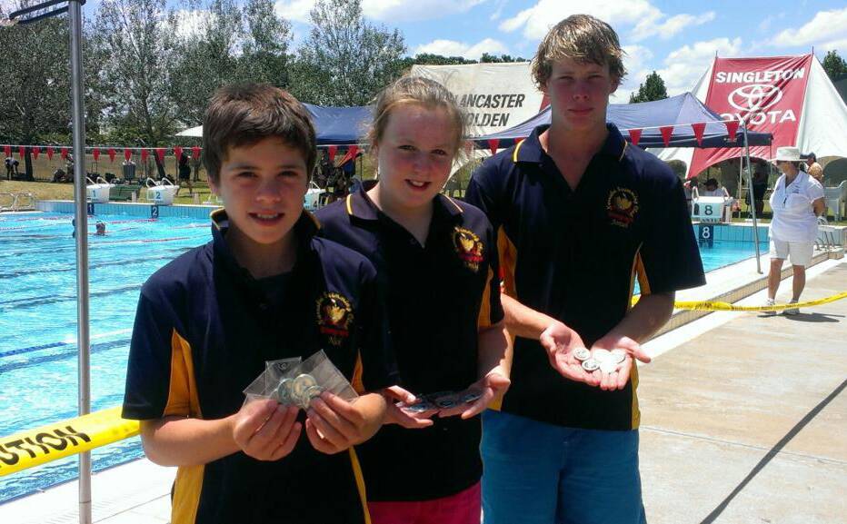 Narrabri’s Nick Tomlinson (left) , Emily Rainger and Josiah Barnes show off their medal haul from last weekend’s Country Regional carnival.