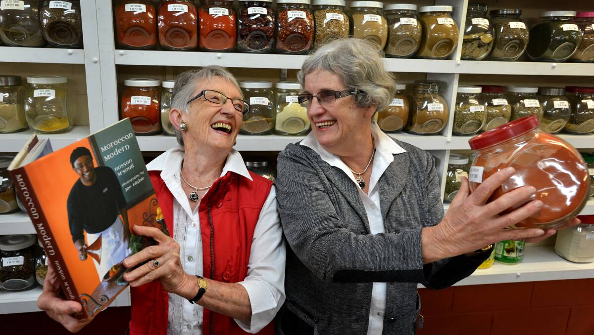 SPICE WITHOUT FIRE: Armidale CWA president Emmie Forge and member Helen Browning now feel up to the Moroccan cooking challenge.  Photo: Barry Smith 060213BSC03