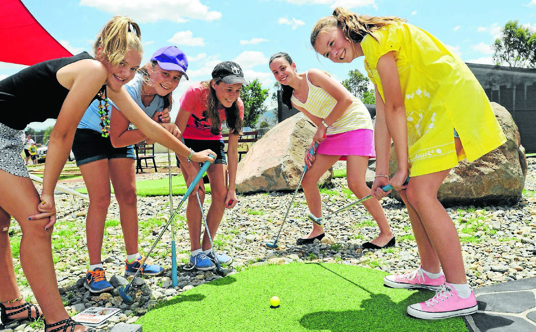 PUTT PUTT POWER: Testing out their skills at Thorny’s Putt Putt yesterday are, from left, Annaliese Collins, Millie Skillen, Clare Harrison, Emma Statham and Bella Kermode. The new facility has averaged 60 visitors a day since opening last month. Photo: Geoff O’Neill 070114GOB01