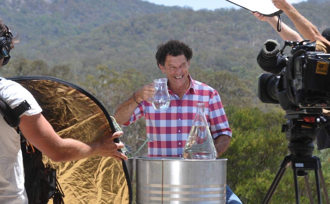 LOTS TO LOVE: Sydney Weekender host Mike Whitney shows off the eucalyptus oil Banalasta produces on-site.  Photo: Geoff O’Neill 040214GOC01