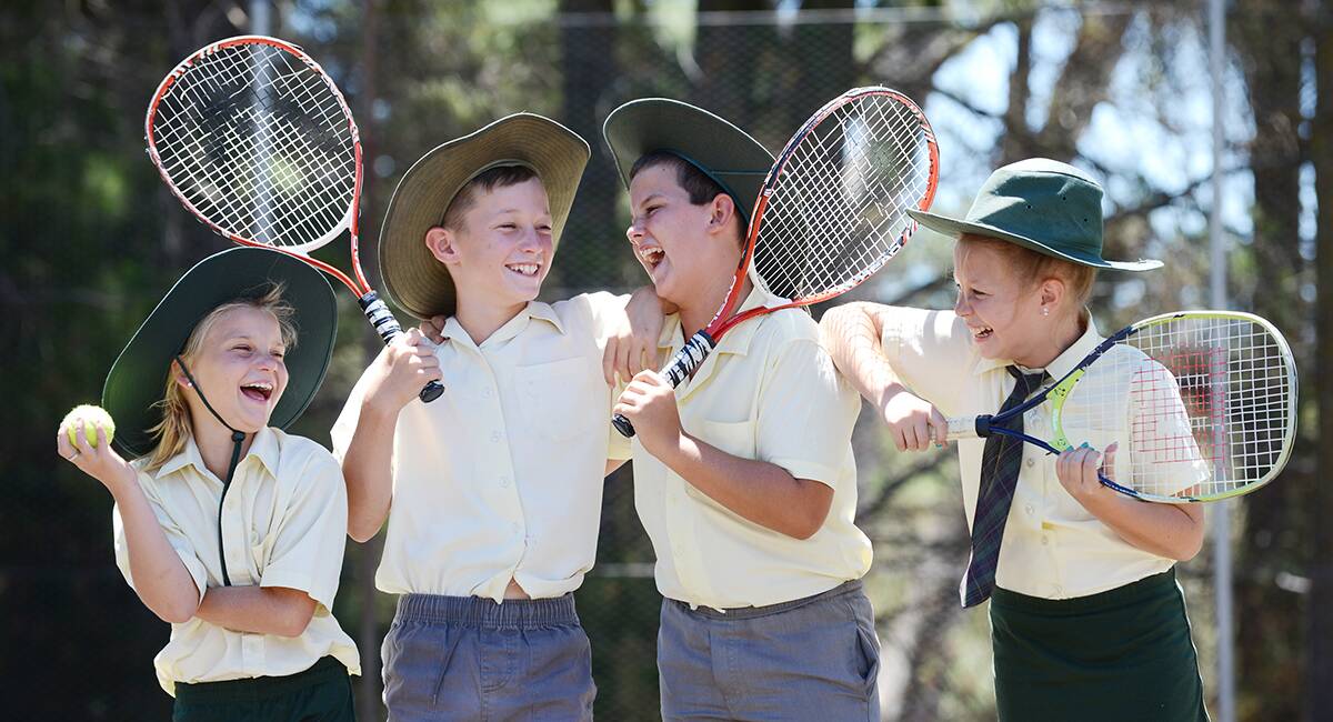 COURT PLAY:  Bendemeer Public School student Teanny Bridges, from Year 4, and Riley Reid, Zac McNee and Tarni Thrift from Year 6, reckon school is something of a racket. Photo: Barry Smith  300114BSC06