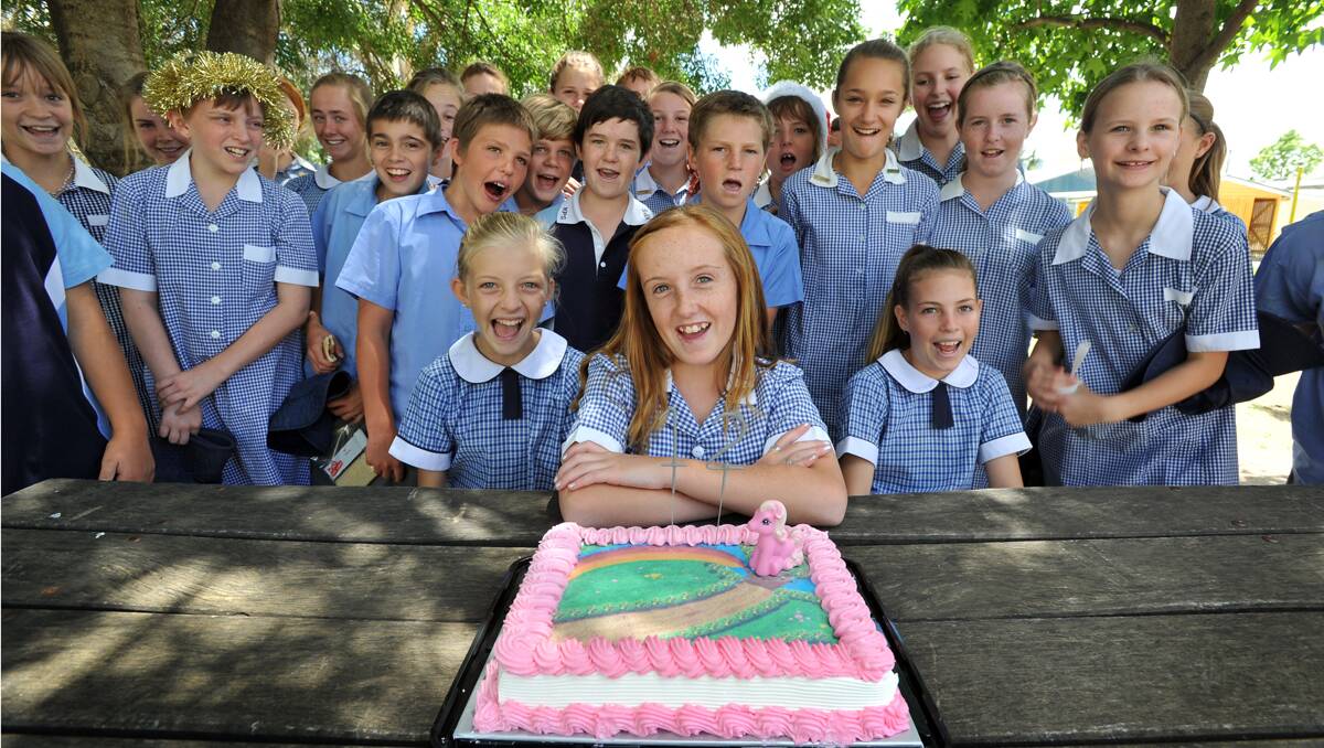 DOZEN DIGITS: Abrianna Dow celebrated her 12th birthday yesterday at Kootingal Public School on 12-12-12 with her year 5/6 classmates. Photo: Barry Smith  121212BSD01