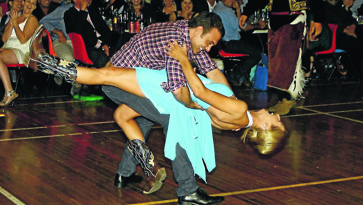 THIS IS HOW IT’S DONE: Channel 7 Dancing With The Stars’ Carmelo Pizzino shows local teacher Kim Hagon the moves on the dance floor. 