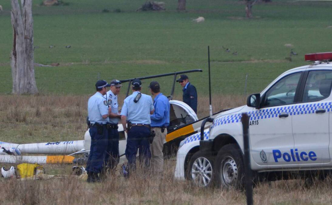 REPORT RELEASED: Police at the scene of the helicopter crash on September 13. Photo: Armidale Express