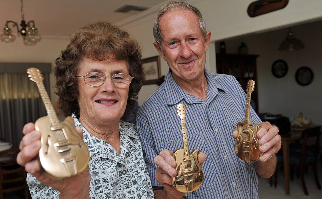 AWARD DUTIES: Dawn and Noel Smith with the yet-to-be-mounted Golden Guitars. Photo: Geoff O'Neill 060114GOE01