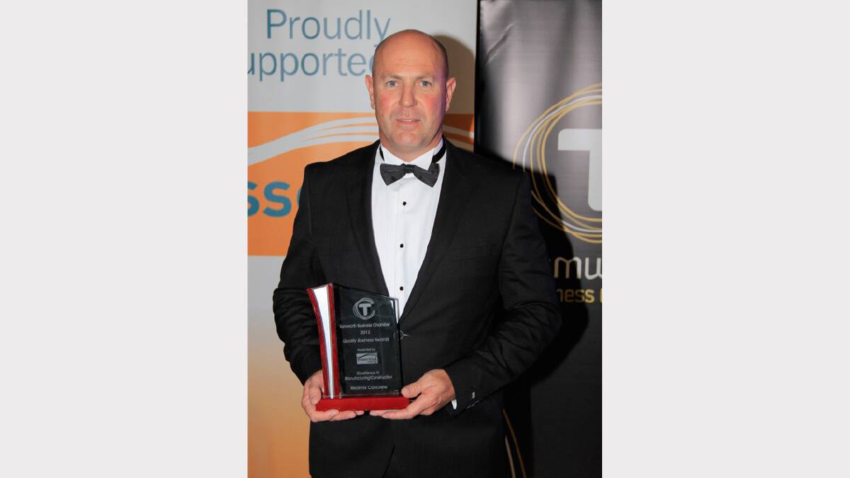 James McDonald from Redimix Concrete with the business award for Excellence in Manufacturing and Construction at the Quality Business Awards held at TRECC on Friday night. Photo: Robert Chappel