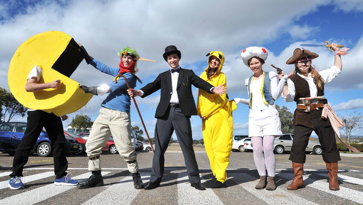 GAME INVASION: Carinya Christian School Year 12 students Josh Wall (Pacman), left, Sam Morris (Jak), Tyler Coleman (Mr Monopoly), Brianna Trickett (Pikachu), Rachel Weekes (Toad from Mario)  and Sharni Adams (Captain Jack Sparrow) took on a different role at school yesterday. Photo: Barry Smith  230712BSB03
