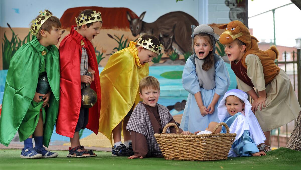 NATIVITY SCENE: Calrossy Preschool five-year-old class members, from left, wise men Nikita Potapov, Jay Thompson and Baden Lewis with ‘Joseph’ Hugh Burnett, ‘Mary’ Alice Murdoch, Sienna Piroute the donkey and Mia Wallace the camel.   Photo: Barry Smith  071212BSD03